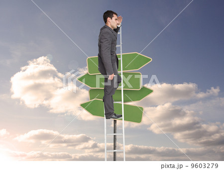Composite image of stern businessman standing on ladder Composite image of stern businessman standing on ladder 9603279