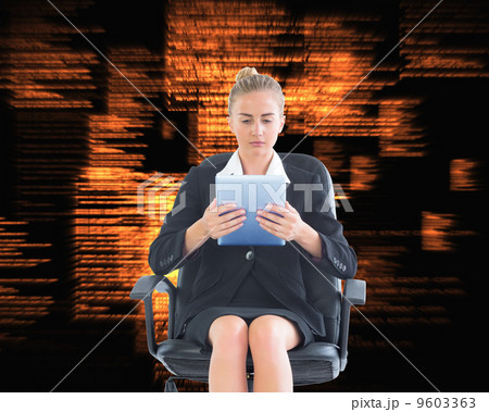 Composite image of front view of concentrated chic businesswoman 9603363