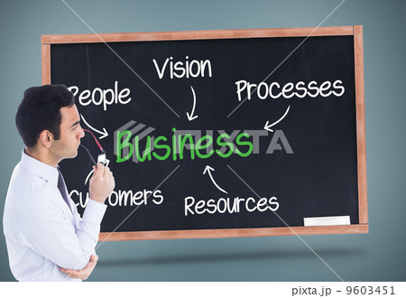 Composite image of unsmiling businessman holding glasses 9603451