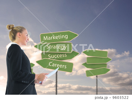 Composite image of businesswoman holding tablet Composite image of businesswoman holding tablet 9603522