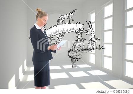 Composite image of businesswoman holding new tablet 9603586