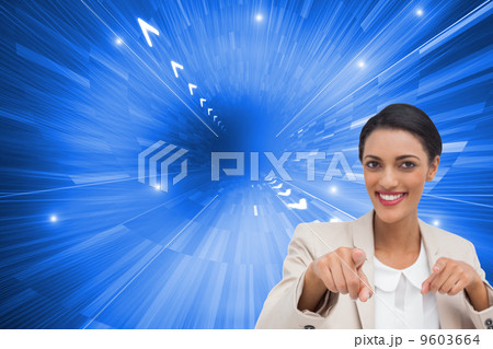Composite image of smiling businesswoman pointing at the camera Composite image of smiling businesswoman pointing at the camera 9603664