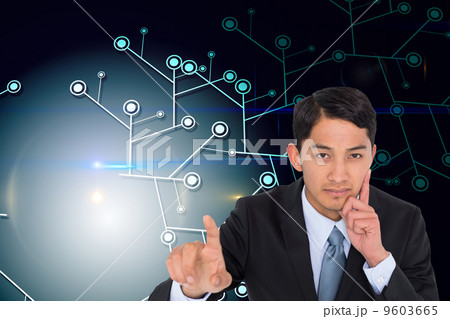 Composite image of thoughtful asian businessman pointing Composite image of thoughtful asian businessman pointing 9603665
