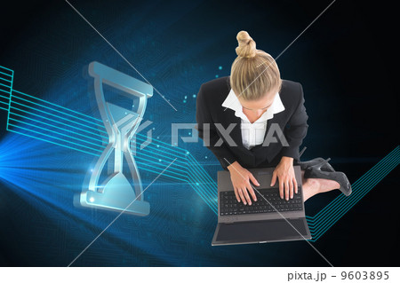 Composite image of businesswoman using laptop Composite image of businesswoman using laptop 9603895