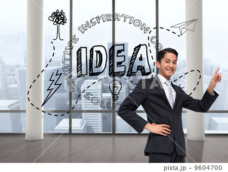 Composite image of smiling asian businessman pointing 9604700