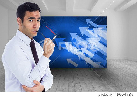 Composite image of unsmiling businessman holding glasses Composite image of unsmiling businessman holding glasses 9604736