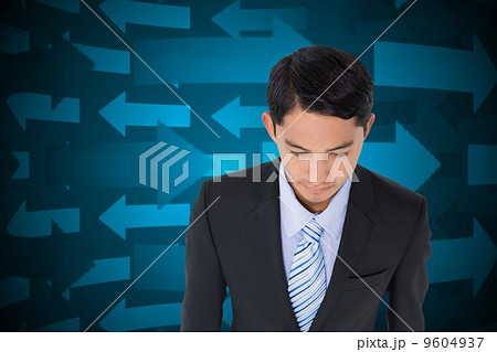 Composite image of serious asian businessman Composite image of serious asian businessman 9604937