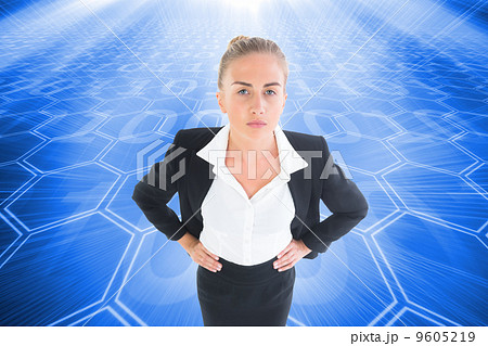 Composite image of businesswoman standing with hands on hips Composite image of businesswoman standing with hands on hips 9605219