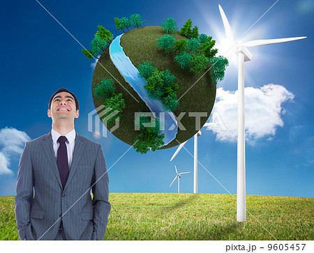 Composite image of smiling businessman standing 9605457