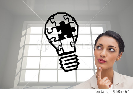 Composite image of smiling businesswoman thinking 9605464