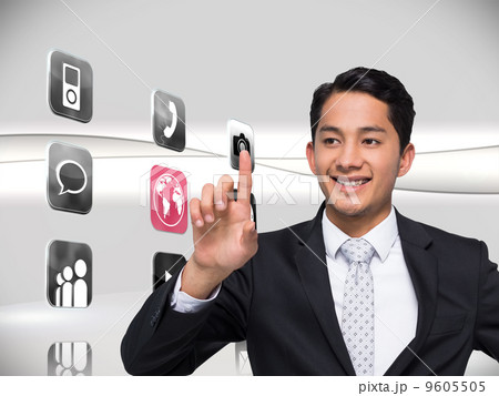 Composite image of smiling asian businessman pointing Composite image of smiling asian businessman pointing 9605505