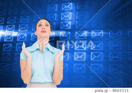 Composite image of concerned young businesswoman praying 9605515