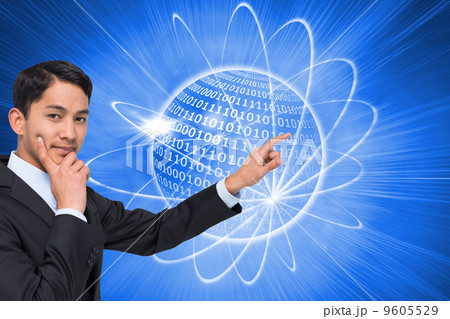 Composite image of thoughtful asian businessman pointing 9605529