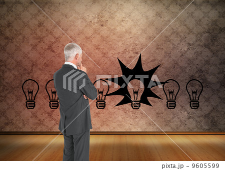 Composite image of thoughtful businessman standing back to camer Composite image of thoughtful businessman standing back to camer 9605599
