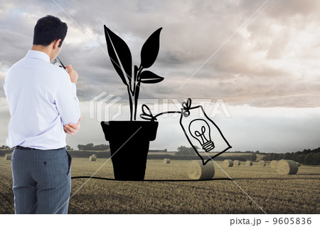 Composite image of businessman holding glasses Composite image of businessman holding glasses 9605836