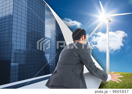 Composite image of businessman catching 9605837