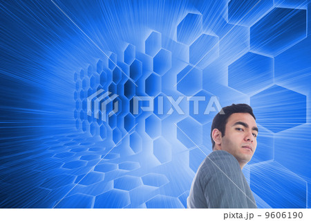 Composite image of unsmiling businessman standing 9606190