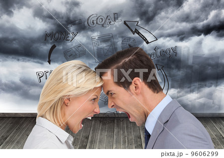 Composite image of colleagues quarreling head against head 9606299