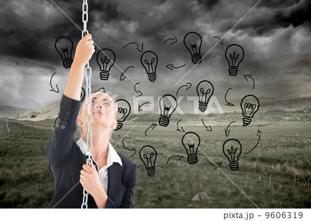 Composite image of businesswoman pulling a chain Composite image of businesswoman pulling a chain 9606319
