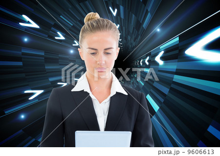 Composite image of businesswoman holding tablet 9606613