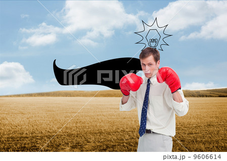 Composite image of businessman with his boxing gloves ready to f 9606614