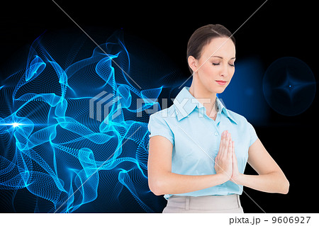 Composite image of peaceful young businesswoman praying 9606927
