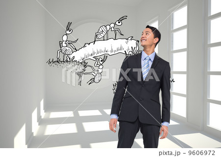 Composite image of smiling asian businessman 9606972