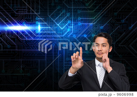 Composite image of thoughtful asian businessman pointing Composite image of thoughtful asian businessman pointing 9606998
