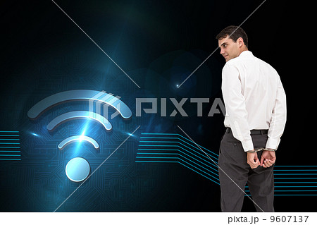 Composite image of businessman wearing handcuffs Composite image of businessman wearing handcuffs 9607137