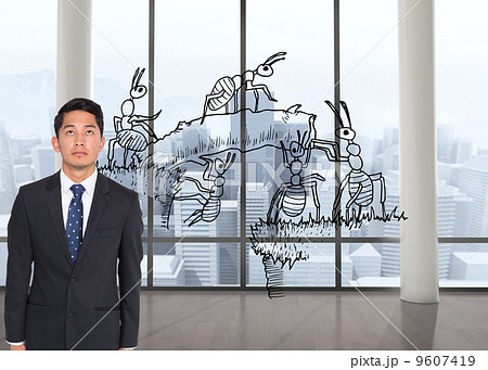 Composite image of stern businessman looking up 9607419