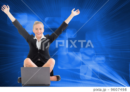 Composite image of businesswoman sitting in front of laptop with 9607498