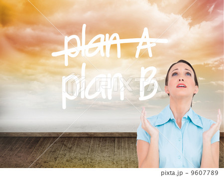 Composite image of concerned young businesswoman praying 9607789