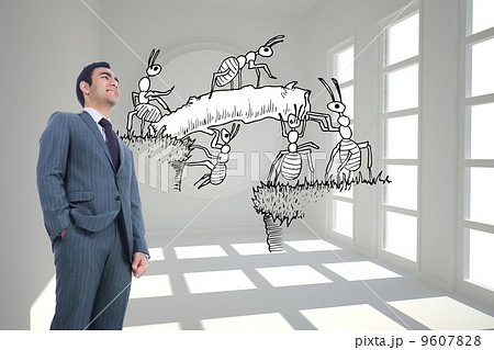 Composite image of smiling businessman standing 9607828