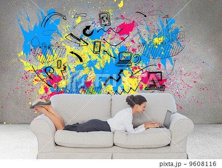 Composite image of business woman lying on couch Composite image of business woman lying on couch 9608116