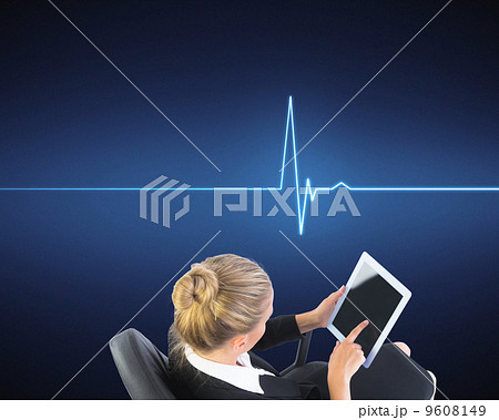 Composite image of businesswoman sitting on swivel chair with ta 9608149