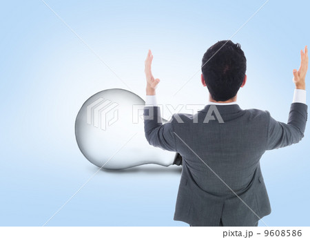 Composite image of businessman with arms raised 9608586