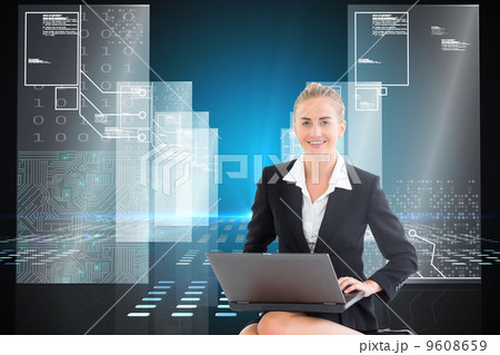 Composite image of businesswoman using laptop 9608659