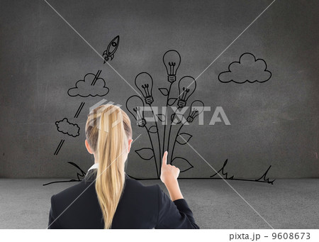 Composite image of business woman pointing somewhere 9608673
