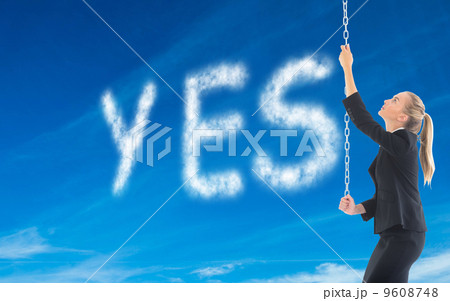 Composite image of businesswoman pulling a chain Composite image of businesswoman pulling a chain 9608748