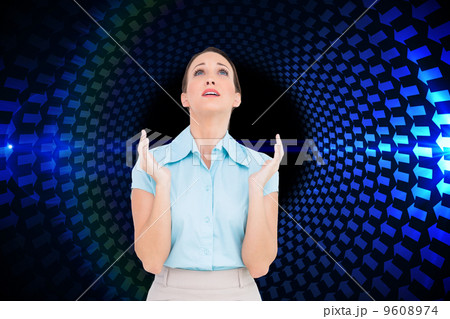 Composite image of concerned young businesswoman praying 9608974