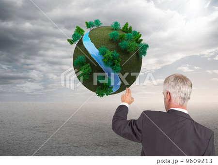 Composite image of rear view of stylish mature businessman point Composite image of rear view of stylish mature businessman point 9609213
