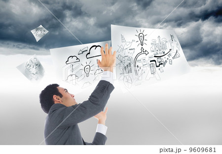 Composite image of unsmiling businessman with arms raised Composite image of unsmiling businessman with arms raised 9609681