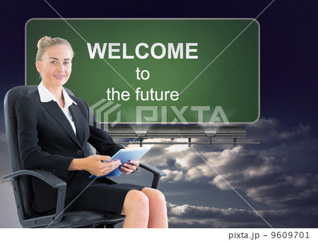 Composite image of businesswoman sitting on swivel chair with ta Composite image of businesswoman sitting on swivel chair with ta 9609701