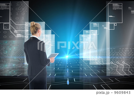 Composite image of businesswoman holding new tablet Composite image of businesswoman holding new tablet 9609843