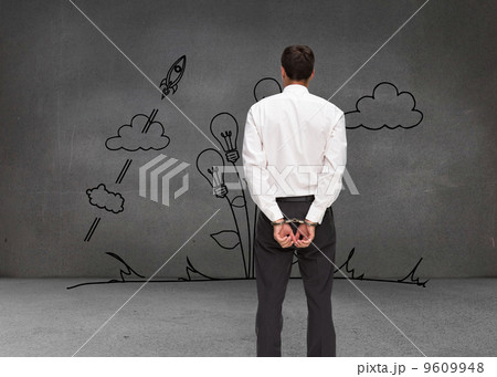 Composite image of rear view of young businessman wearing handcu 9609948