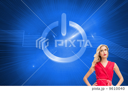 Composite image of elegant blonde standing hands on hips 9610040