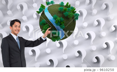 Composite image of smiling asian businessman pointing 9610250