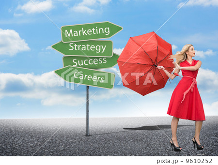 Composite image of beautiful woman posing with a broken umbrella 9610252