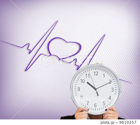 Composite image of businesswoman in suit holding a clock Composite image of businesswoman in suit holding a clock 9610357