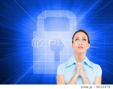 Composite image of troubled young businesswoman praying Composite image of troubled young businesswoman praying 9610479